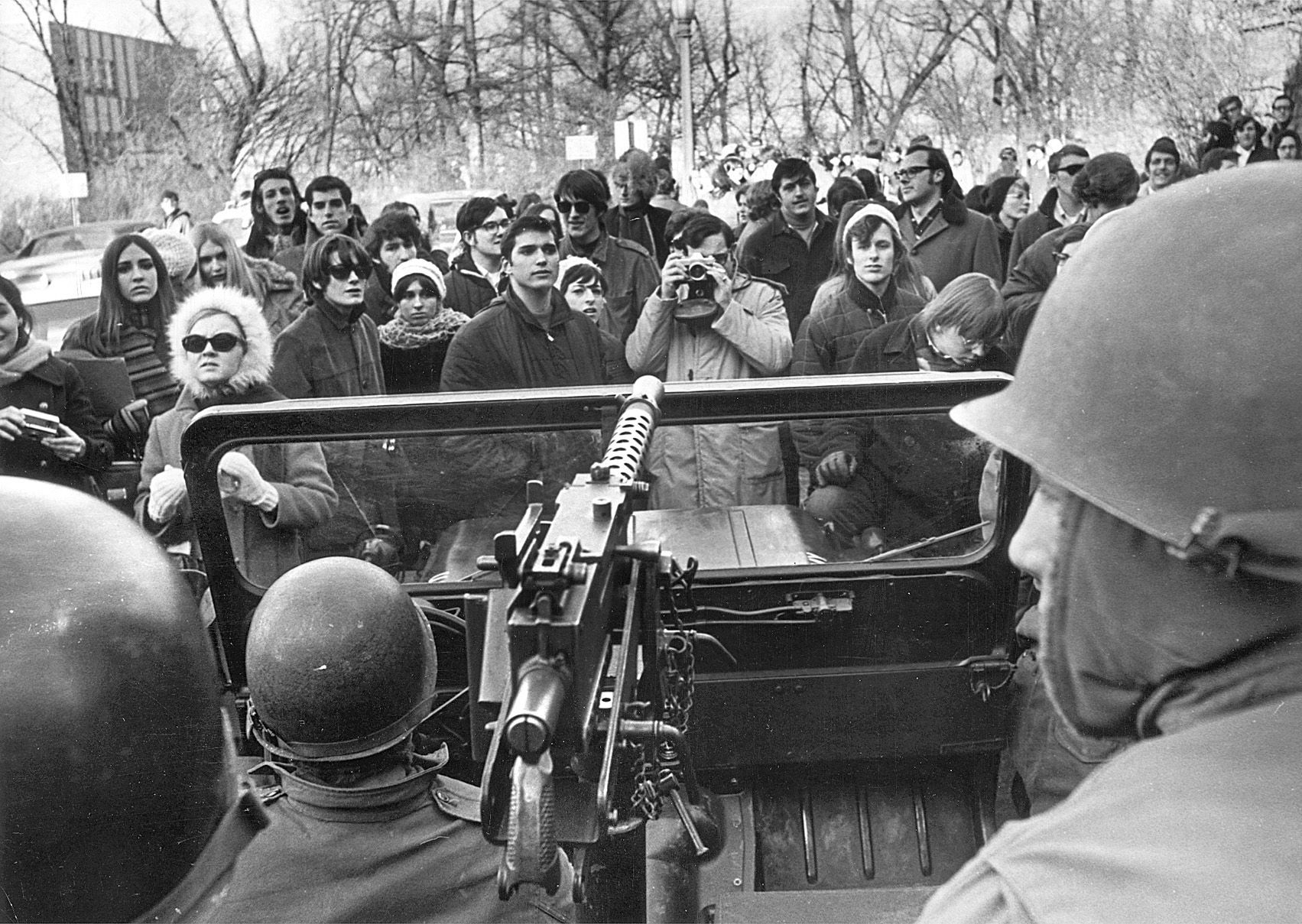 Students block a jeep